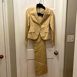 Express fitted Khaki suit includes jacket and pants. Jacket is so 2 pants 0